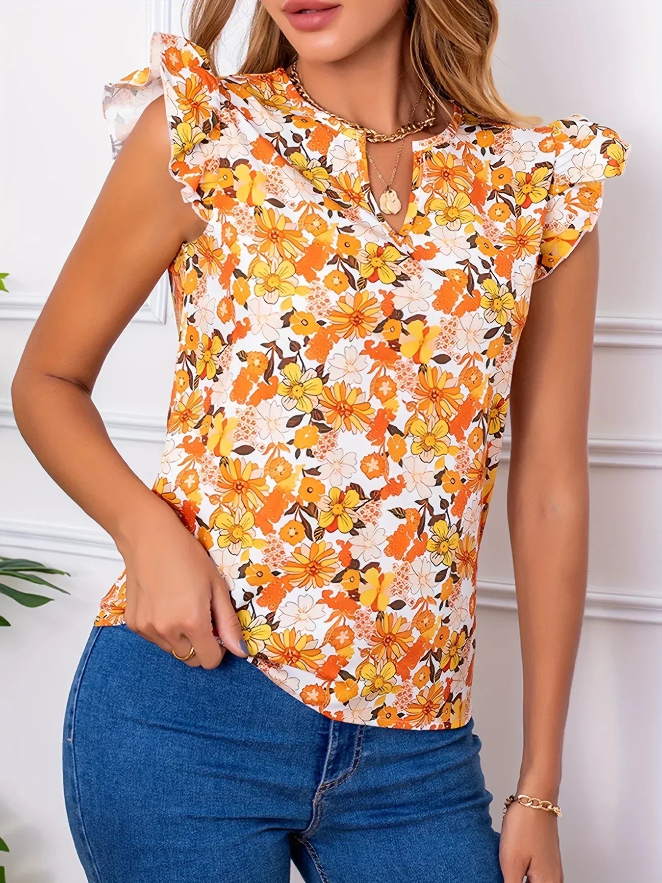 Damski top w pomarańczowe kwiaty