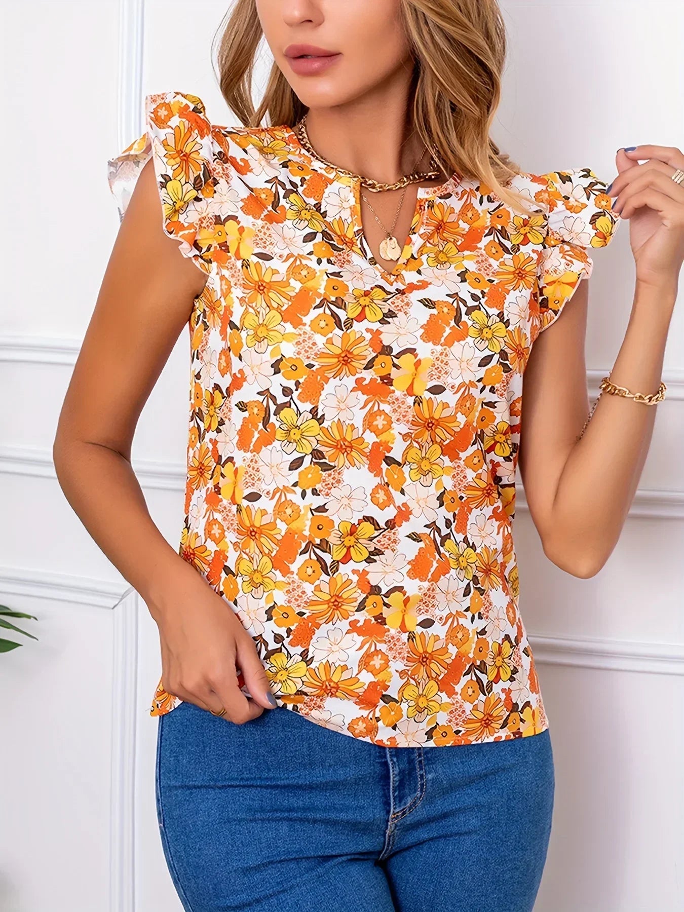 Damski top w pomarańczowe kwiaty