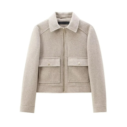 Beige wool zip-up jacket with two large front pockets and classic collar on white background