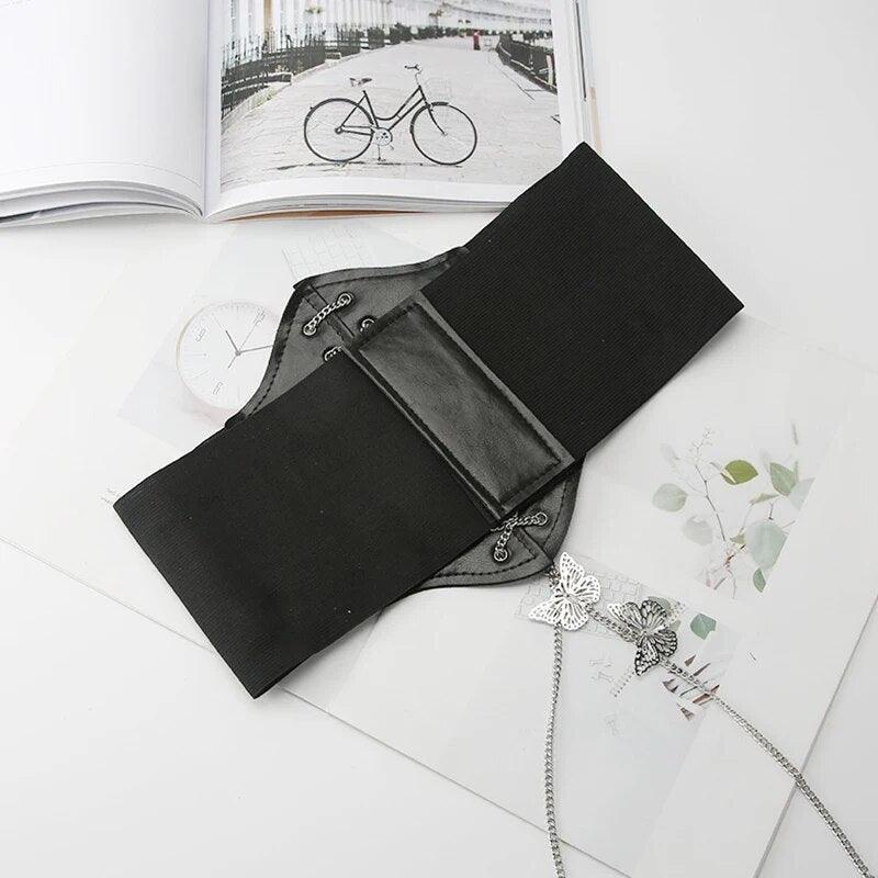 Gorset wiązany na łańcuch z motylkami