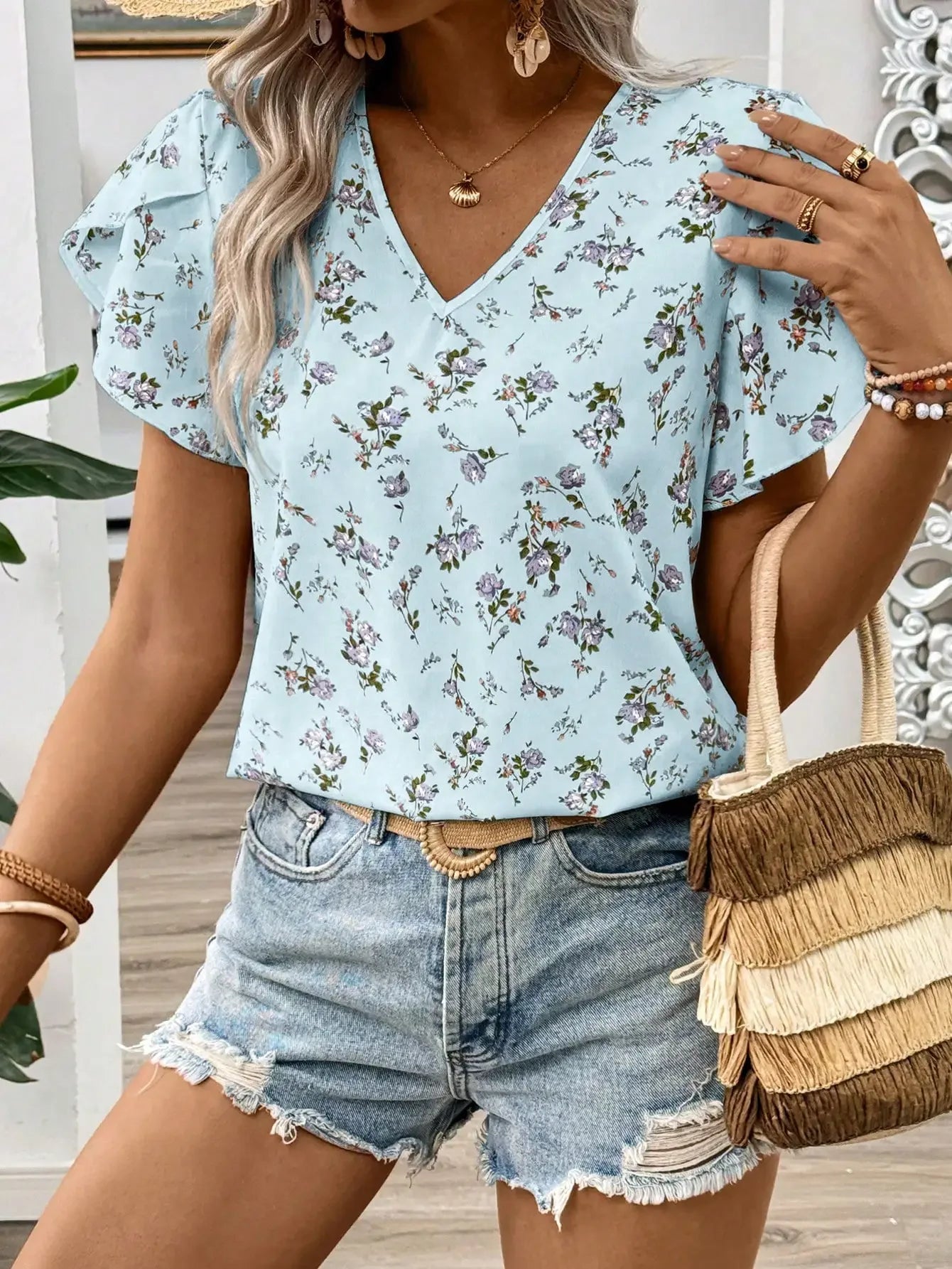 Kwiecista błękitna bluzka damska