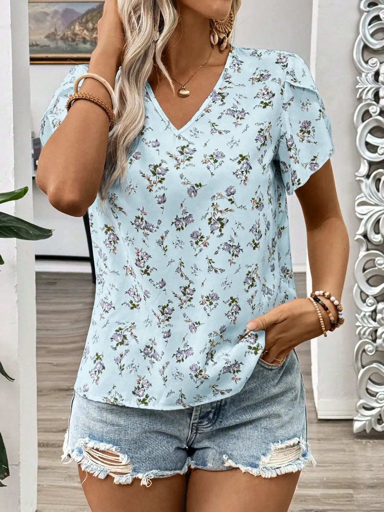 Kwiecista błękitna bluzka damska